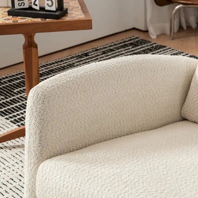 Fauteuil à bascule rembourré à dossier haut avec repose-pieds et pieds en bois