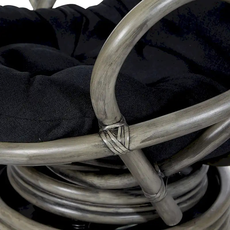 Fauteuil à bascule pivotant en rotin tressé avec coussin